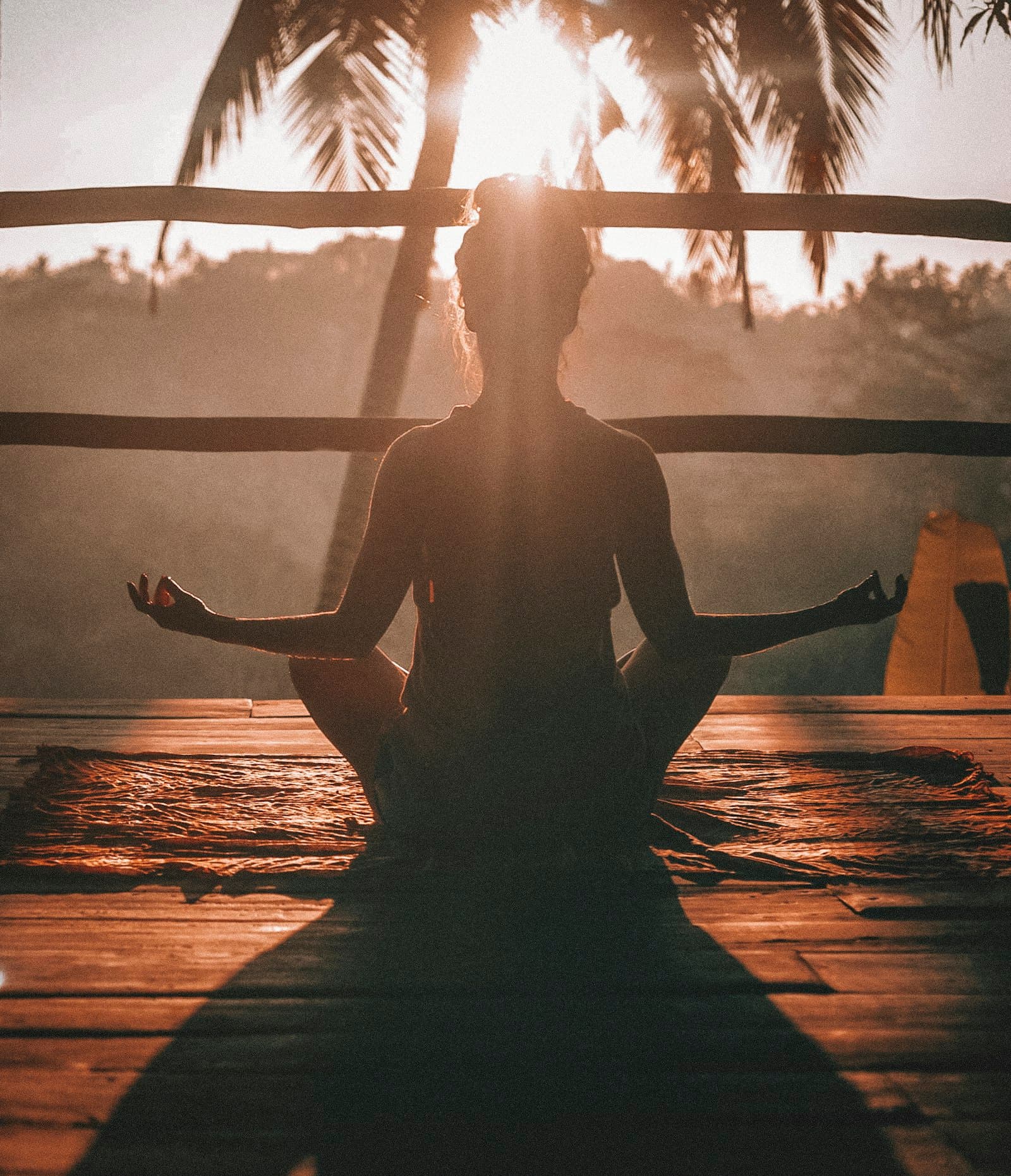 Person practicing calm breathing in a serene setting